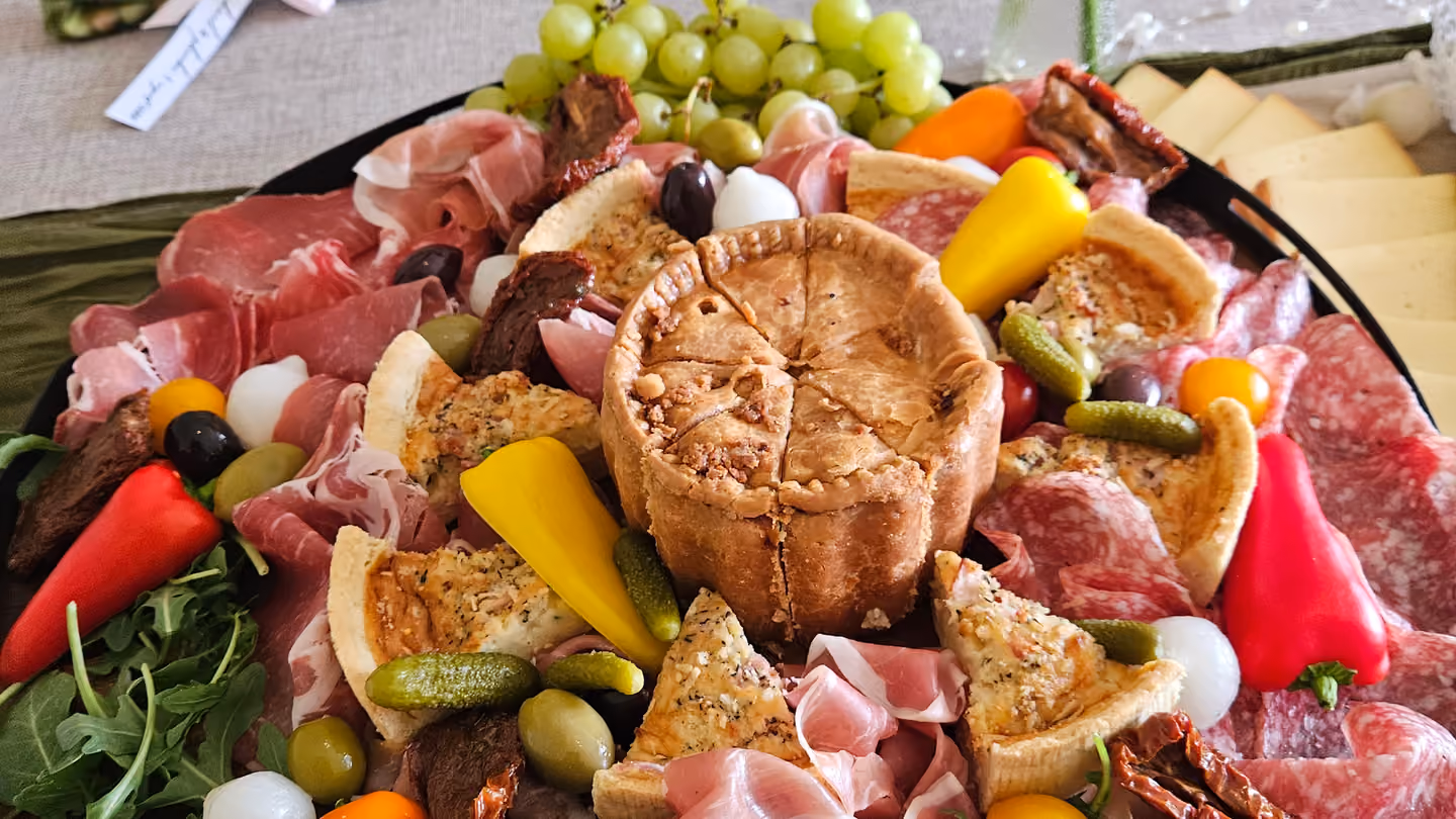 A grazing table of charcuterie, cheese and fruit